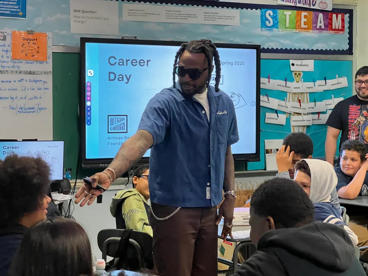 Career Day speaker engaging with students in a classroom.
